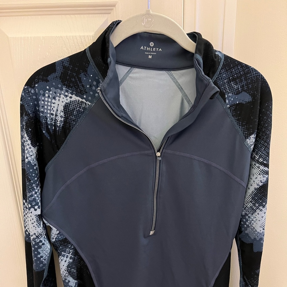 Athleta 1/4 zip warm up jacket.  Excellent quality, performance fabric